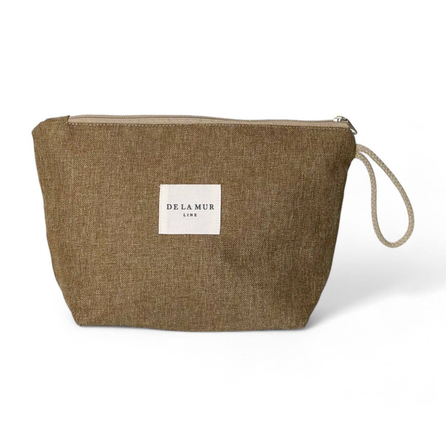 Beauty case in tessuto liscio color ocra con manico in corda beige.