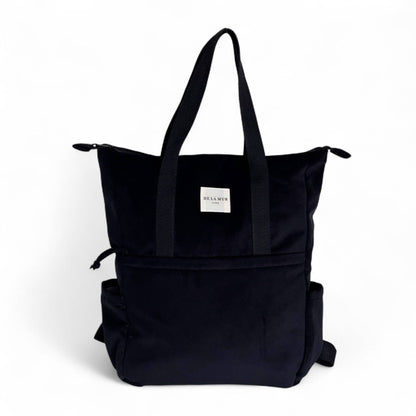 Zaino in velluto nero con manici regolabili e spallacci in cotone.